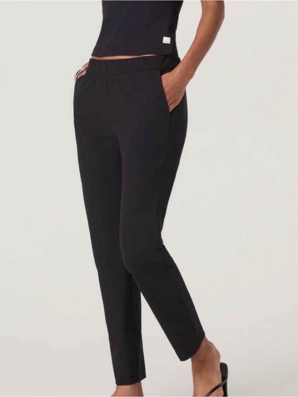 Two Vuori women’s Miles Ankle pants medium - two pairs- black and cerise